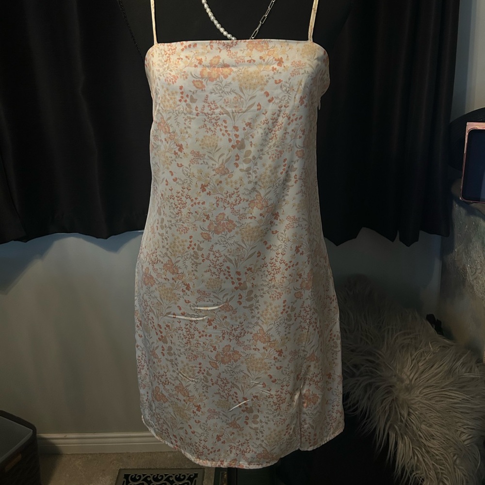 Cream and pink silk slip dress with adjustable straps and a floral pattern